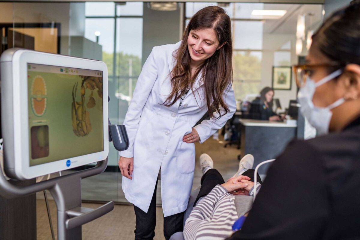 Dr-horton-minnesota-orthodontics Dr. Horton looking at orthodontic technology