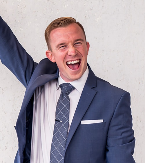 Adult-treatment-horton-ortho Young man in suit looking happy