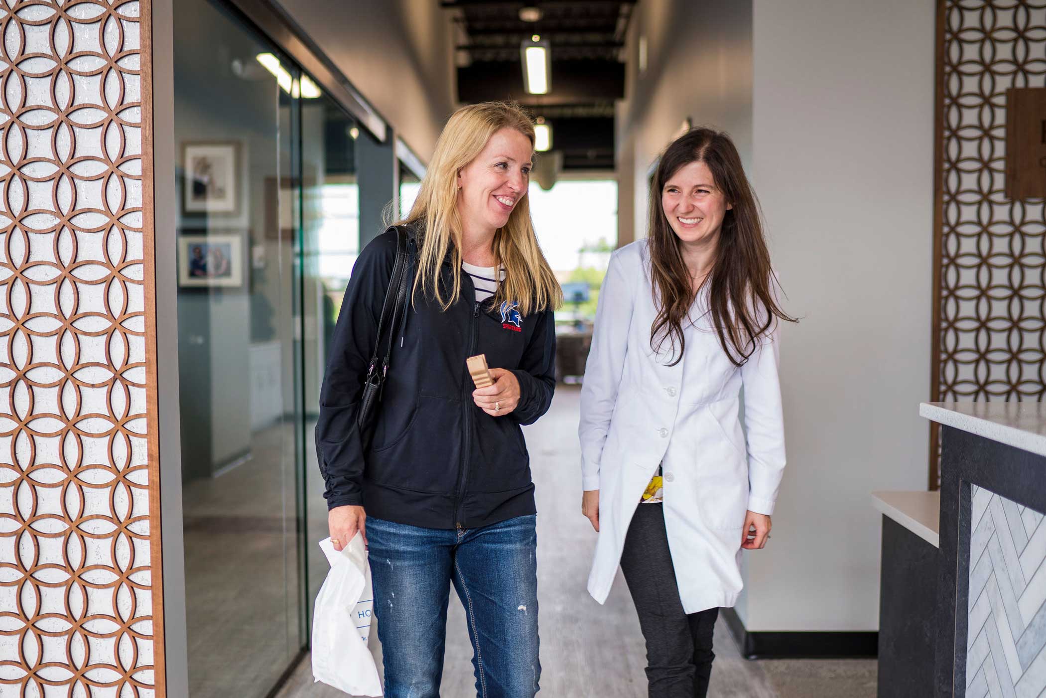 Dr-horton-walking-with-patient-horton-orthodontics Surgical orthodontics