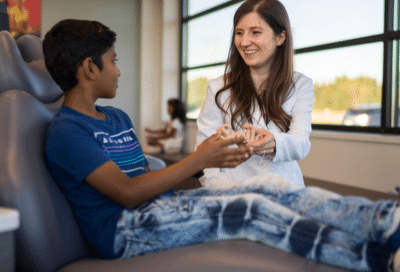 Our story: horton orthodontics 11 Dr. Horton working with a patient and telling our story at horton orthodontics