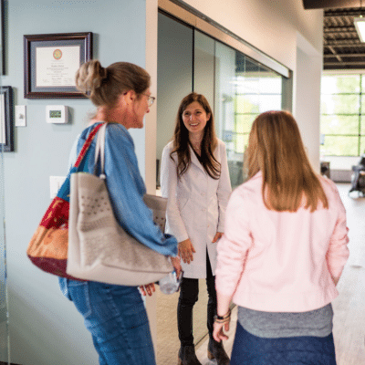 The benefits of a family-friendly orthodontist 3 Dr. Heather horton meeting with a family at horton orthodontics, representing the benefits of a family-friendly orthodontist